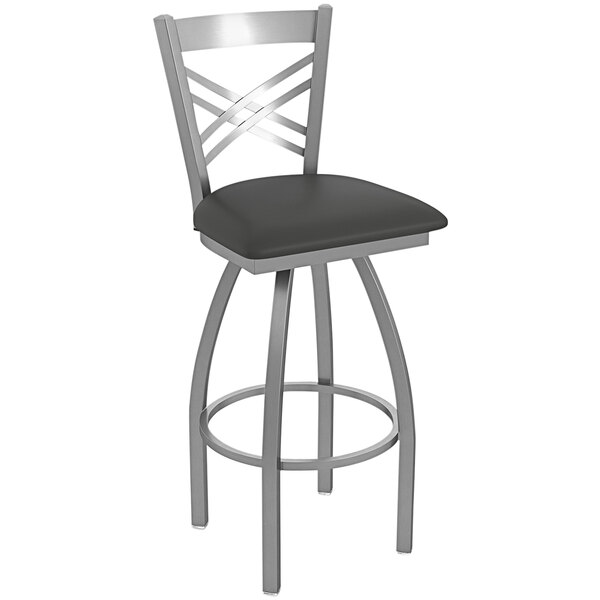 A Holland Bar Stool stainless steel outdoor bar stool with a black padded seat.