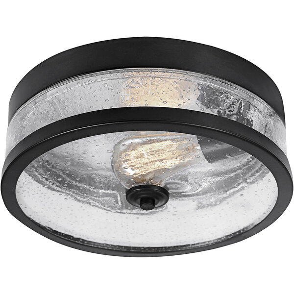 A Globe dark bronze flush mount light fixture with clear seeded glass shade.