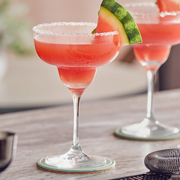 Two Twisted Alchemy watermelon margaritas on a table.