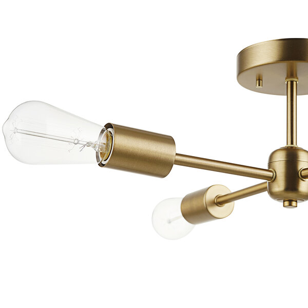 A Globe Refined Matte Brass light fixture with two light bulbs.
