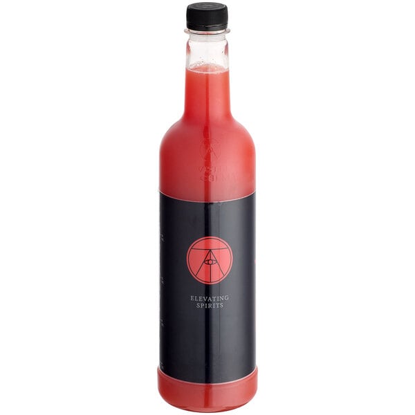 A bottle of Twisted Alchemy Cold-Pressed watermelon juice with a black and red label on a table in a cocktail bar.