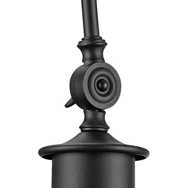 A black metal Globe Vintage wall sconce with a round base and white shade.