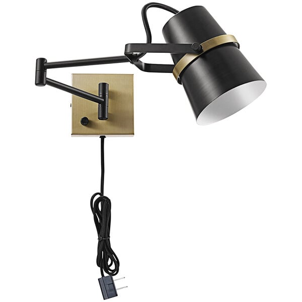 A Globe black and gold wall lamp with a cord and swing arm.