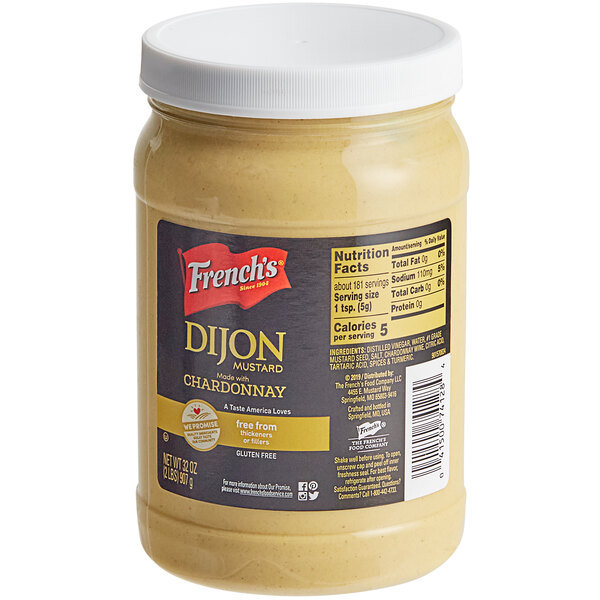 A case of 6 French's Dijon Mustard jars with white lids.