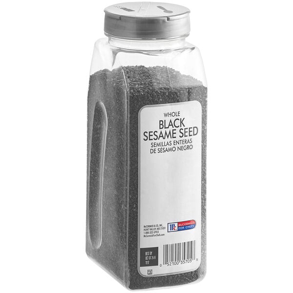 A plastic container of McCormick Culinary Black Sesame Seeds.