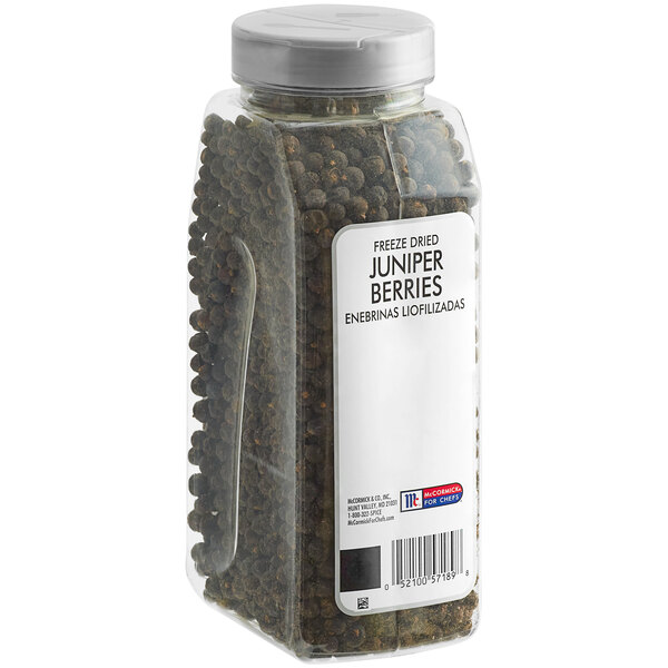 A plastic container of McCormick Culinary Freeze-Dried Juniper Berries.