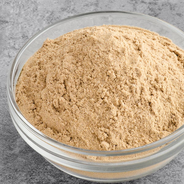 A bowl of Spice Classics Au Jus Gravy Mix powder.