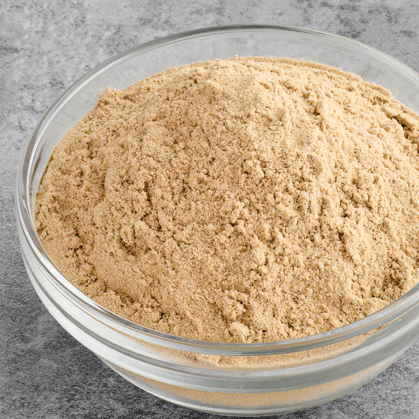 A bowl of Spice Classics Au Jus Gravy mix powder.