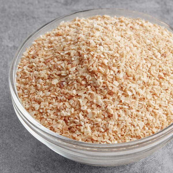 A bowl of McCormick Culinary Minced Garlic on a table.