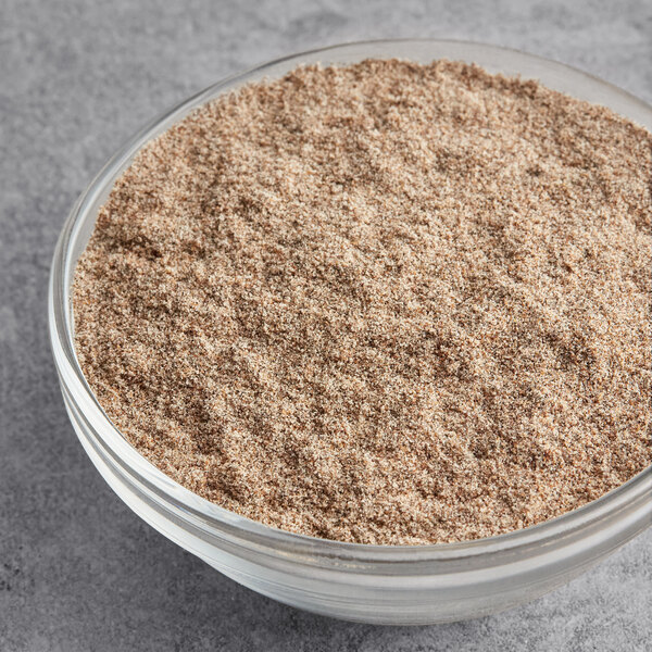 A bowl of McCormick Culinary Ground Cardamom.