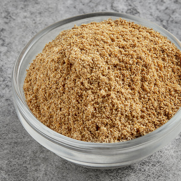 A white bowl of McCormick Culinary Ground Coriander.