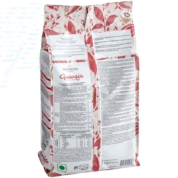 A white bag of Valrhona dark chocolate feves with text on it.