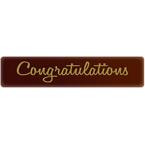 A brown rectangular Chocolatree chocolate decoration with gold text that says "Congratulations"