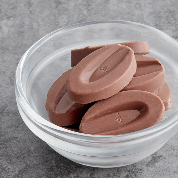A bowl of Valrhona Jivara milk chocolate feves.