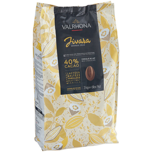 A black package of Valrhona Jivara 40% Milk Chocolate Feves with yellow text.
