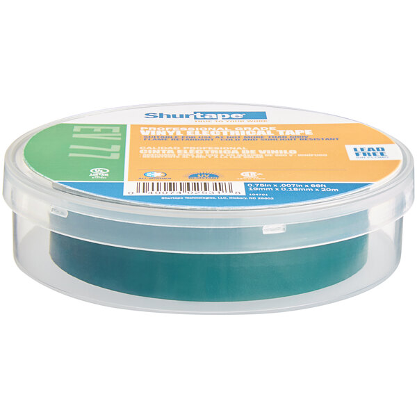 A roll of Shurtape green electrical tape in a plastic container.