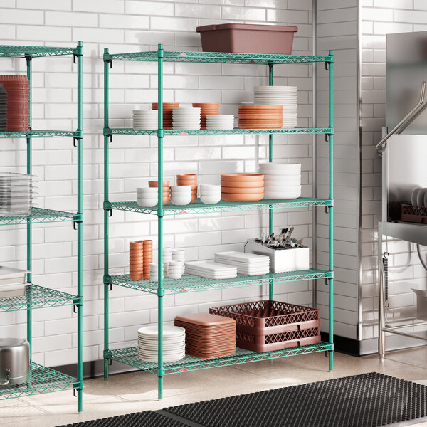 A green wire shelving unit with multiple adjustable shelves, holding various kitchenware items.