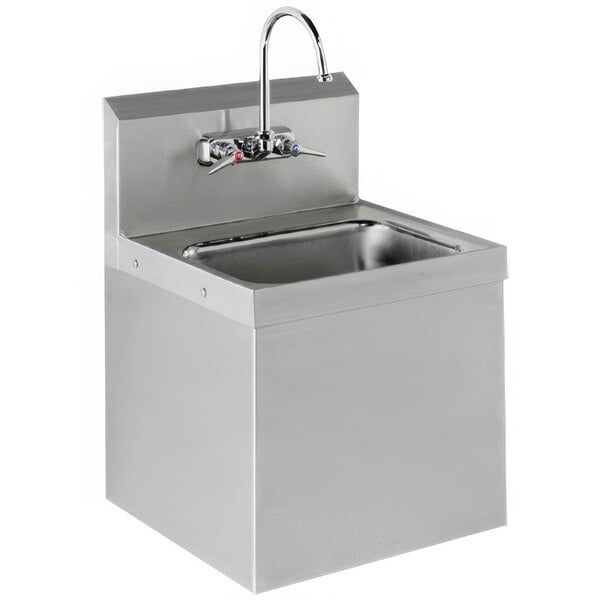 An Advance Tabco hand sink with faucet and drain.