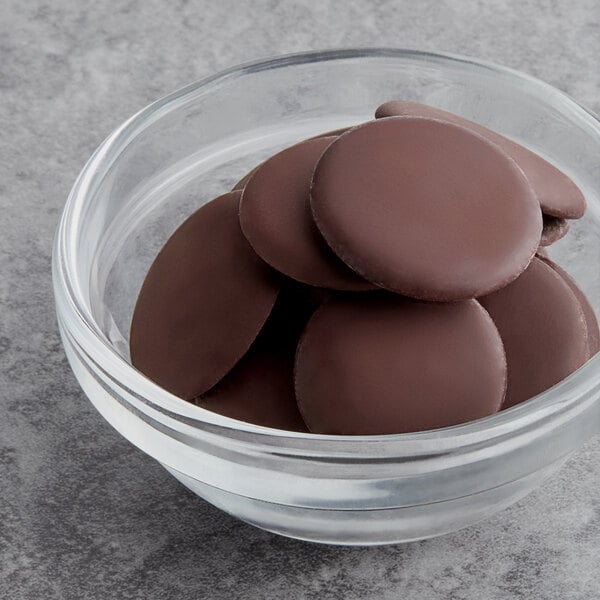 A glass bowl filled with Republica del Cacao dark chocolate 