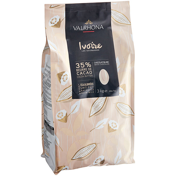A black bag of Valrhona Ivoire white chocolate feves with a white label.