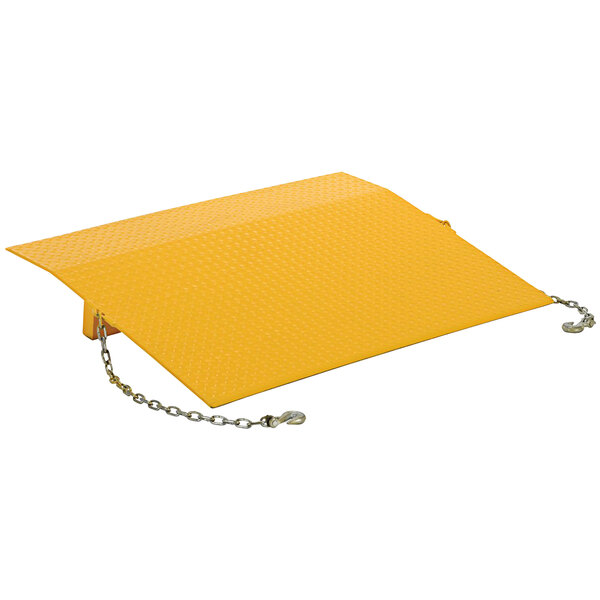 A yellow metal plate with a chain attached.