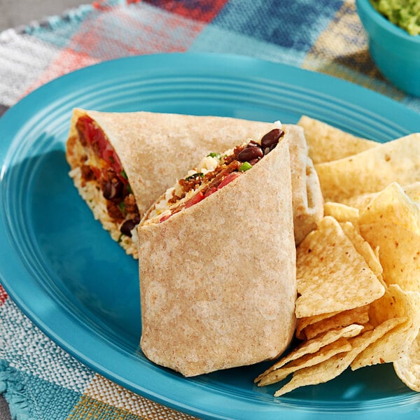 A blue plate with a burrito, tortilla wraps, and chips.