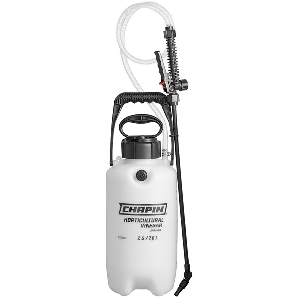 A white Chapin poly sprayer with a black hose and handle.