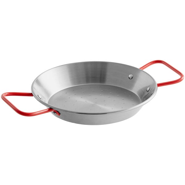 A silver Vigor carbon steel paella pan with red handles.