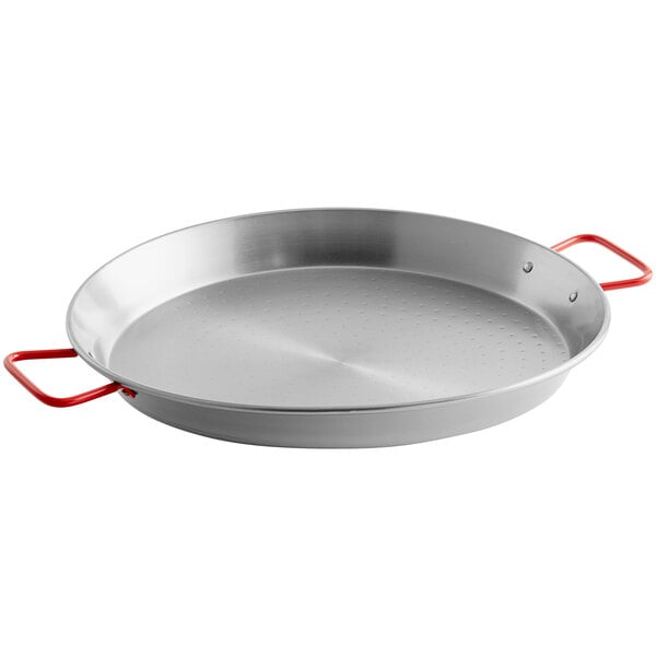 A close-up of a silver Vigor paella pan with red handles.