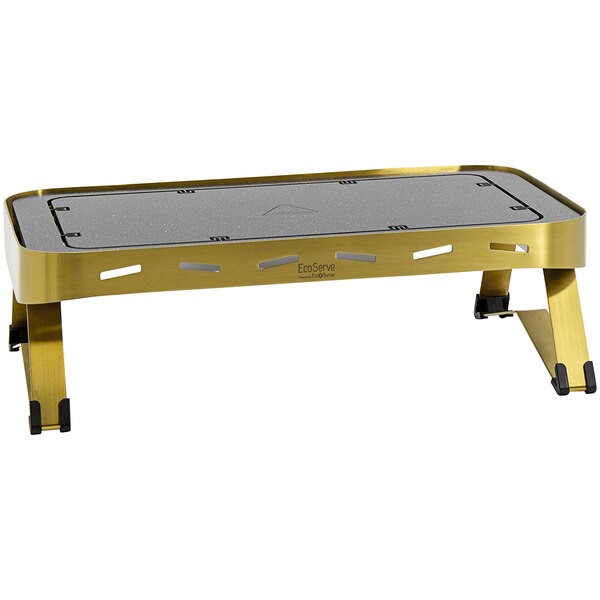 An EcoServe GN base with gold legs on a table.