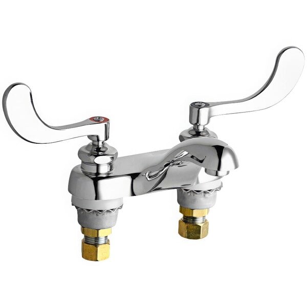A Chicago Faucets deck-mounted faucet with 4" wristblade handles and a cast brass spout.