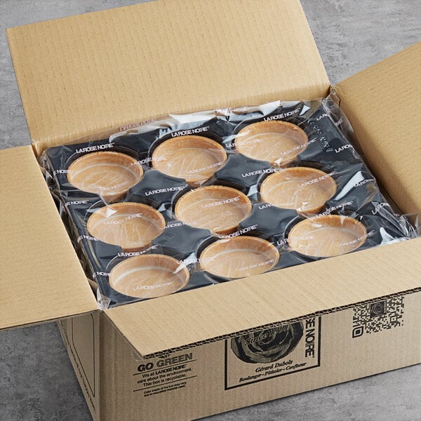 A box with a tray of La Rose Noire large round vanilla tart shells inside.