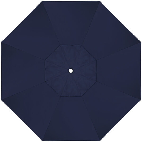 A close-up of a navy blue California Umbrella with a white center.