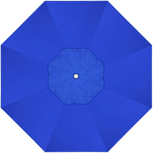 A blue sunbrella canopy with a white circle in the center.