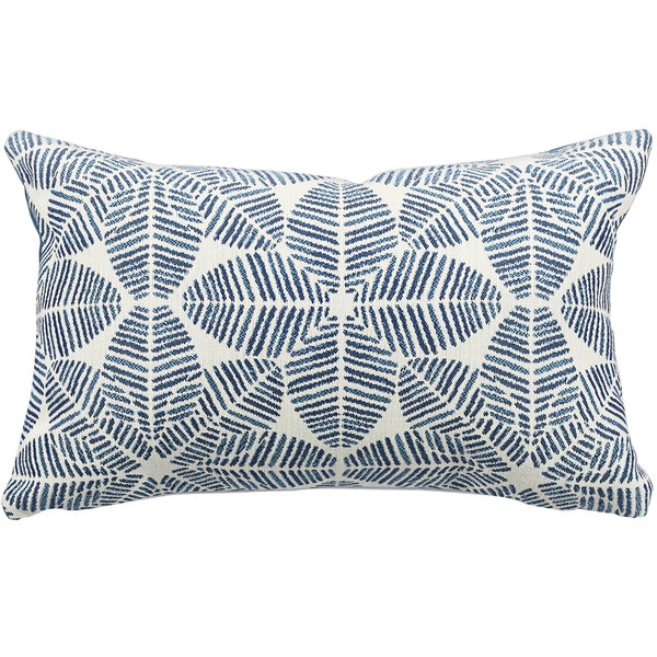 An Astella Palmetto throw pillow with a blue and white geometric design.