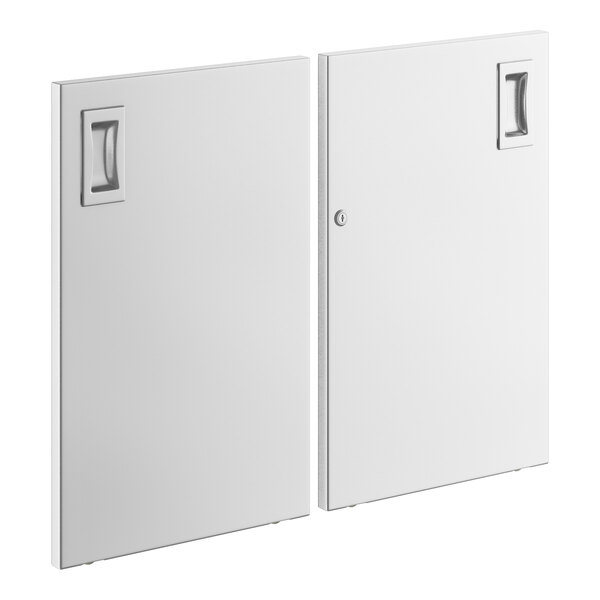 Two white rectangular doors with square metal handles.