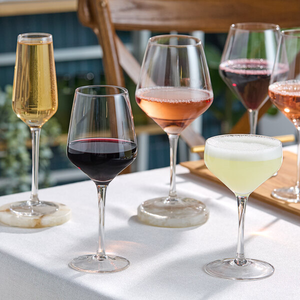 A group of Acopa Silhouette wine glasses on a table.