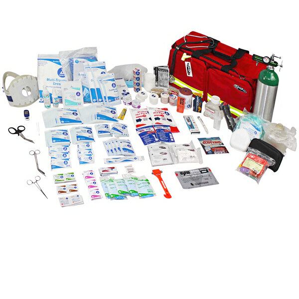 A green Kemp USA medical supply pack with various first aid supplies.