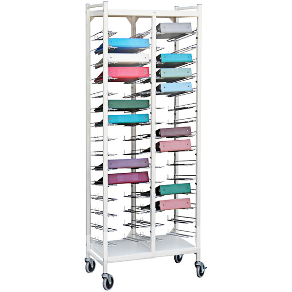 A beige Omnimed metal cart with different colored binder storage boxes on it.