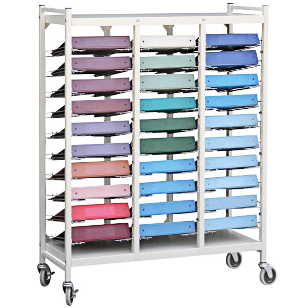 An Omnimed beige storage cart with colorful binders on it.