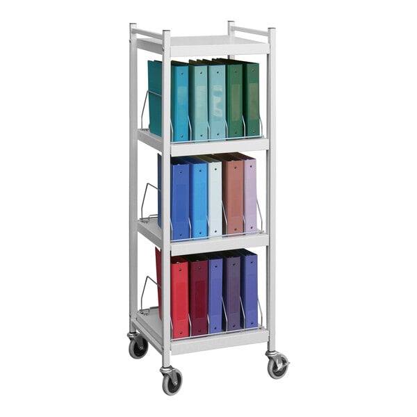 A light gray Omnimed medical cart with binders on it.