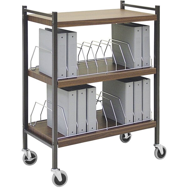 An Omnimed woodgrain cart with binders on it.