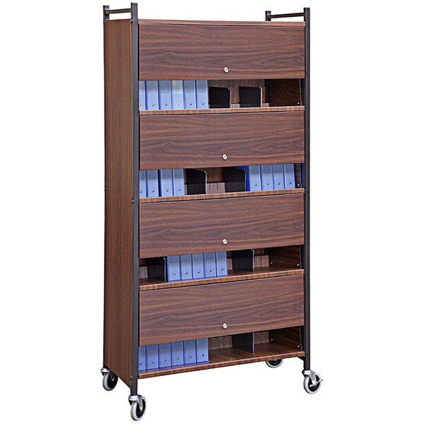 An Omnimed woodgrain cabinet rack with blue folders on a shelf.