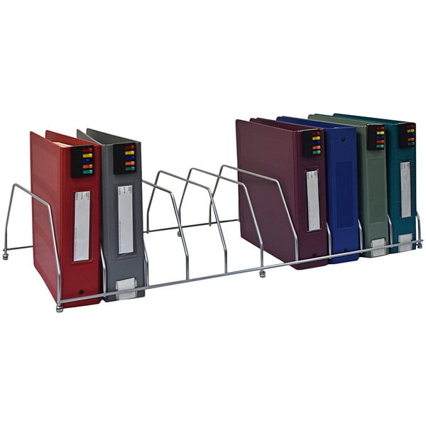 A metal rack with several binders in it.