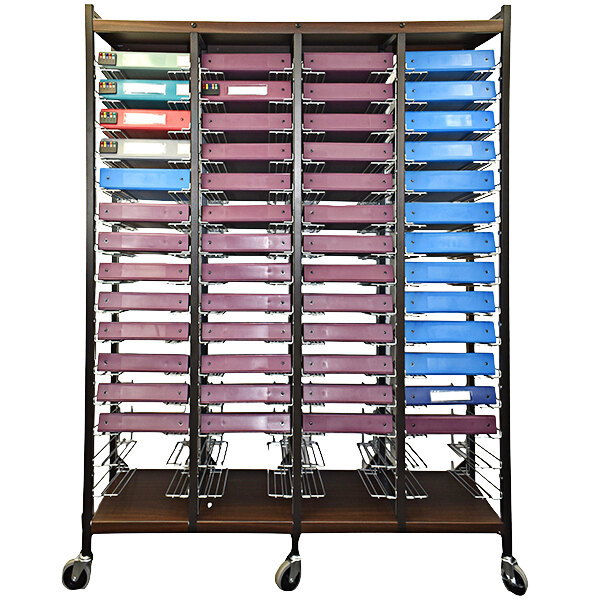 An Omnimed woodgrain cart with colorful files in it.