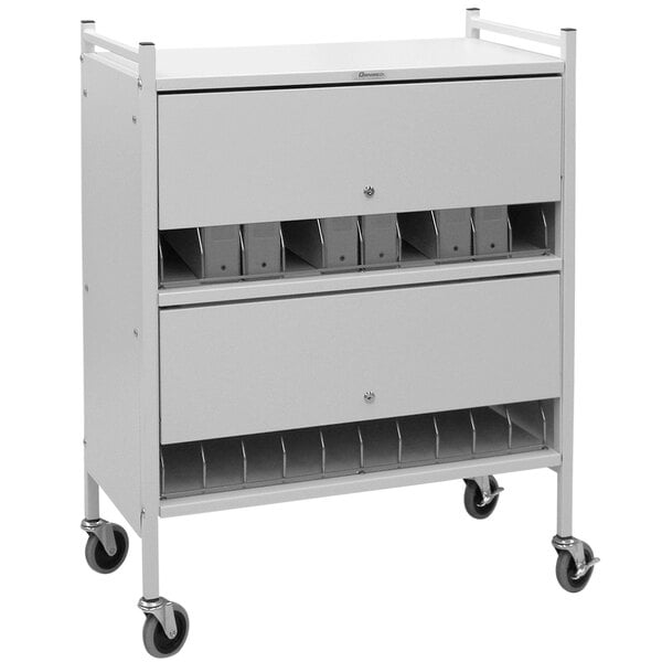 An Omnimed light gray metal cart with locking doors and 20 binder shelves.