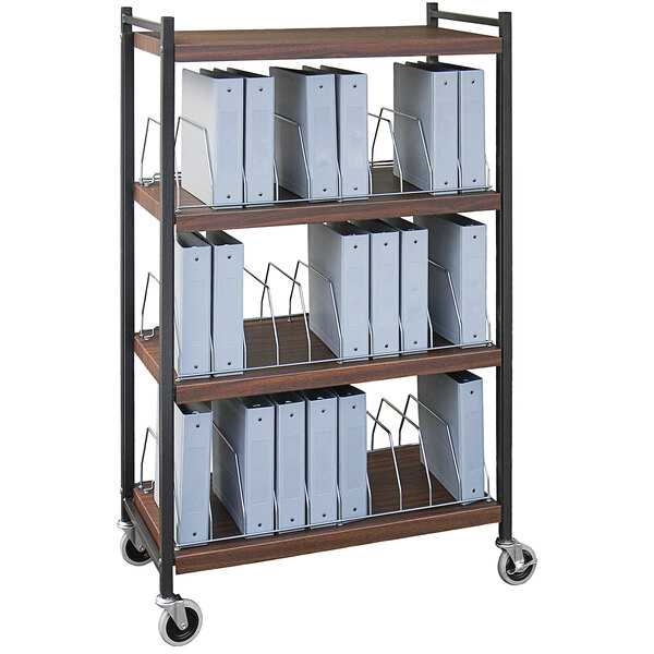 A white Omnimed metal cart with vertical shelves holding binders.