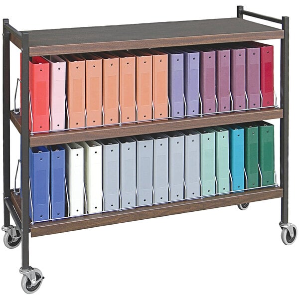 A woodgrain Omnimed horizontal cart with multiple shelves of binders.