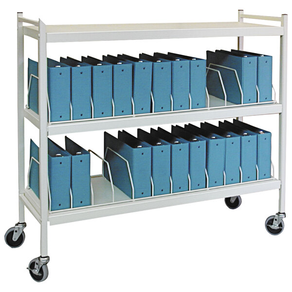 A white Omnimed metal cart with blue binders on it.