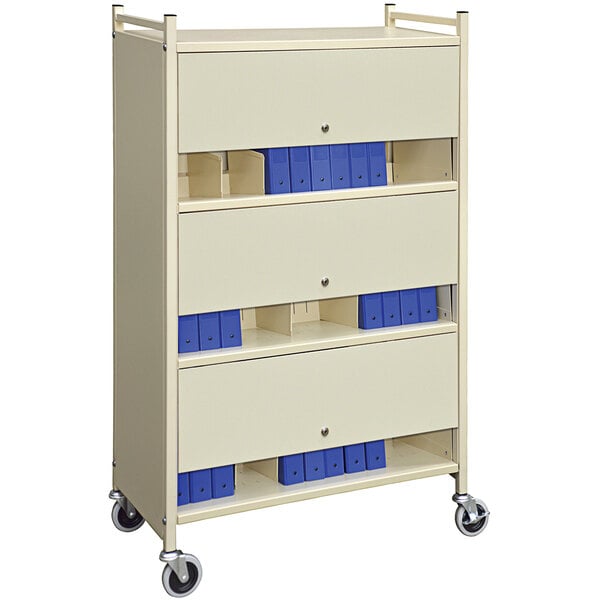 A beige Omnimed 3-shelf cabinet style cart with blue locking doors.